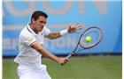 EASTBOURNE, ENGLAND - JUNE 16: Tobias Kamke of Germany plays a backhand against Daniel Evans of Great Britain during their Men's Singles first round match on day three of the Aegon International at Devonshire Park on June 16, 2014 in Eastbourne, England.  (Photo by Steve Bardens/Getty Images)